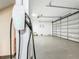 Spacious two-car garage equipped with Tesla charger and epoxy floor at 3924 N Ridge Ave, Tampa, FL 33603