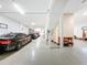 Spacious garage with several parked cars, featuring a clean, modern design and ample storage space at 3924 N Ridge Ave, Tampa, FL 33603
