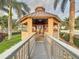 Charming gazebo with a walkway surrounded by lush landscaping and tranquil scenery at 3924 N Ridge Ave, Tampa, FL 33603