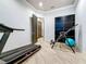 Home gym featuring a treadmill and exercise equipment for fitness enthusiasts at 3924 N Ridge Ave, Tampa, FL 33603