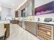 The contemporary kitchen is equipped with sleek countertops, stainless appliances, and a wine refrigerator at 3924 N Ridge Ave, Tampa, FL 33603