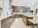 The gourmet kitchen features sleek countertops, stainless appliances, and custom backsplash at 3924 N Ridge Ave, Tampa, FL 33603