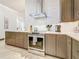 This kitchen boasts stainless steel appliances, custom cabinets, and designer tile backsplash at 3924 N Ridge Ave, Tampa, FL 33603