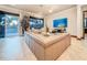 Bright living room featuring tile flooring, comfortable seating, and a view of the lanai at 3924 N Ridge Ave, Tampa, FL 33603