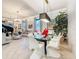 Bright living space showcasing a modern dining table, tile floors, and a glimpse of the piano at 3924 N Ridge Ave, Tampa, FL 33603