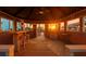 Beautiful sunset reflecting into the open outdoor bar with a guitar on display and bar seating at 3924 N Ridge Ave, Tampa, FL 33603