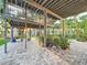 Spacious outdoor patio with lush greenery and shade, ideal for entertaining and relaxing at 3924 N Ridge Ave, Tampa, FL 33603