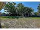 Large back yard offering plenty of space to relax and enjoy outdoor activities at 4042 Darlington Rd, Holiday, FL 34691