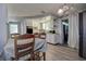 Dining room with modern vinyl flooring and open access to the kitchen at 4042 Darlington Rd, Holiday, FL 34691