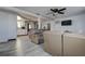 A home's living room with a ceiling fan and a large comfortable leather sofa at 4042 Darlington Rd, Holiday, FL 34691