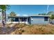Single-story home featuring a screened-in lanai and an expansive backyard, offering great space for outdoor enjoyment at 4511 Huntington Ne St, St Petersburg, FL 33703