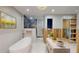 Bathroom showcasing a soaking tub, walk-in shower, marble surfaces, and modern fixtures at 4511 Huntington Ne St, St Petersburg, FL 33703