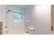 Bright renovated bathroom featuring white subway tile with dark grout and a shower over tub at 4511 Huntington Ne St, St Petersburg, FL 33703