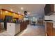 Virtually staged kitchen with stainless steel appliances, center island, and adjacent dining area at 4511 Huntington Ne St, St Petersburg, FL 33703