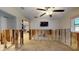 Open floor plan living room under construction, revealing the frame, with TV on the wall at 4511 Huntington Ne St, St Petersburg, FL 33703