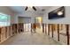 Open floor plan living room under construction, revealing the frame, with TV on the wall at 4511 Huntington Ne St, St Petersburg, FL 33703