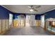 Serene living space boasts a sliding barn door, tile flooring, and natural light at 4511 Huntington Ne St, St Petersburg, FL 33703