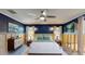 Inviting bedroom with dark blue walls, hardwood floors, coordinated decor, and cozy bedding at 4511 Huntington Ne St, St Petersburg, FL 33703
