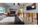 Virtually staged open concept bedroom with TV and stylish decor at 4511 Huntington Ne St, St Petersburg, FL 33703