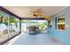 Screened patio features a vaulted ceiling and outdoor seating with a seamless transition to the yard at 4511 Huntington Ne St, St Petersburg, FL 33703