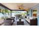 Screened-in patio boasting a vaulted ceiling, outdoor seating, and a seamless transition to the yard at 4511 Huntington Ne St, St Petersburg, FL 33703