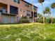 Townhome backyard features low maintenance landscaping with lawn, perfect for relaxing or entertaining at 4624 Willet Cooper Ct, Tampa, FL 33619
