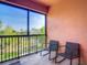 Relax on this balcony with seating and a beautiful view at 4624 Willet Cooper Ct, Tampa, FL 33619
