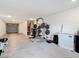 Finished basement showcasing space for a home gym with weightlifting equipment and storage at 4624 Willet Cooper Ct, Tampa, FL 33619