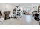 Finished basement featuring home gym with weight rack and fitness equipment at 4624 Willet Cooper Ct, Tampa, FL 33619