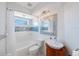 Well-lit bathroom featuring a modern vanity, tiled shower, and a clean, contemporary design at 4815 Queen Palm Ne Ter, St Petersburg, FL 33703
