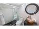 Modern bathroom with a glass-enclosed shower, unique vessel sink, and decorative mirror at 4815 Queen Palm Ne Ter, St Petersburg, FL 33703