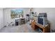Well-lit room with a cozy atmosphere, featuring a comfortable work space and an ample storage area at 4815 Queen Palm Ne Ter, St Petersburg, FL 33703