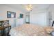 Bright bedroom with comfortable furnishings and tasteful decor, illuminated by a ceiling fan at 4815 Queen Palm Ne Ter, St Petersburg, FL 33703
