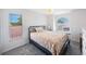 Cozy bedroom with a comfortable bed, complemented by natural light streaming through the windows at 4815 Queen Palm Ne Ter, St Petersburg, FL 33703