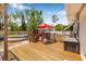 Wooden deck in backyard, featuring a red umbrella and above ground pool at 4920 17Th N Ave, St Petersburg, FL 33710