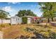 Backyard featuring a deck, shed, and above ground pool in sunny day at 4920 17Th N Ave, St Petersburg, FL 33710