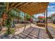 Large wooden deck and patio area with a pergola, above ground pool, and playground in the backyard at 4920 17Th N Ave, St Petersburg, FL 33710