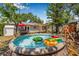 Backyard featuring an above ground pool, swing set, and outdoor seating area at 4920 17Th N Ave, St Petersburg, FL 33710
