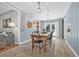 Open dining area with hardwood floors, a view of the kitchen, and a cozy atmosphere at 4920 17Th N Ave, St Petersburg, FL 33710
