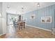 Charming dining room featuring a wooden table, beadboard walls, and access to the backyard at 4920 17Th N Ave, St Petersburg, FL 33710