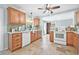Bright kitchen featuring tile flooring, wooden cabinets, and modern appliances at 4920 17Th N Ave, St Petersburg, FL 33710