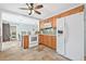 Bright kitchen featuring tile flooring, wooden cabinets, and modern appliances at 4920 17Th N Ave, St Petersburg, FL 33710