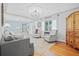 Bright living room with hardwood floors, tray ceilings, and comfortable seating arrangements at 4920 17Th N Ave, St Petersburg, FL 33710