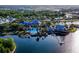 Aerial view of a community clubhouse with a pool, docks, and waterways, offering a vibrant recreational lifestyle at 5603 Tybee Island Dr, Apollo Beach, FL 33572