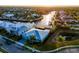 Gorgeous waterfront home with lush tropical landscaping, a metal roof, and stunning water views at 5603 Tybee Island Dr, Apollo Beach, FL 33572