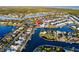 Stunning aerial view of waterfront homes along canals, showcasing beautiful landscaping and boating opportunities at 5603 Tybee Island Dr, Apollo Beach, FL 33572