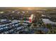 Gorgeous sunset aerial view of waterfront homes and canals, creating a picturesque and serene community setting at 5603 Tybee Island Dr, Apollo Beach, FL 33572