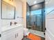 Modern bathroom with glass shower, single vanity, large mirror, and contemporary fixtures at 5603 Tybee Island Dr, Apollo Beach, FL 33572