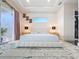 Bright bedroom featuring a decorative rug, modern lamps, and sliding glass doors leading to the outside at 5603 Tybee Island Dr, Apollo Beach, FL 33572