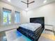 Modern bedroom features a luxurious bed, stylish decor, and ample natural light at 5603 Tybee Island Dr, Apollo Beach, FL 33572